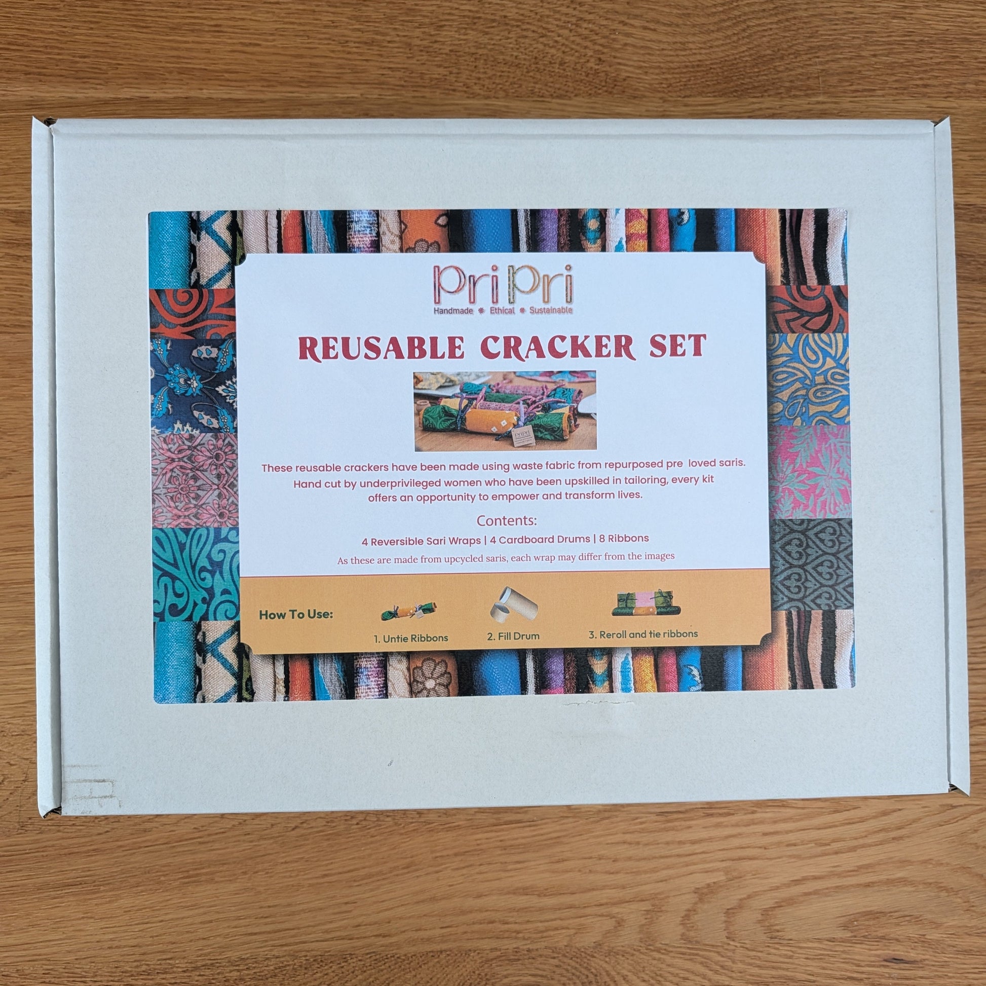 Pri Pri reusable cracker set packaging on a wooden surface