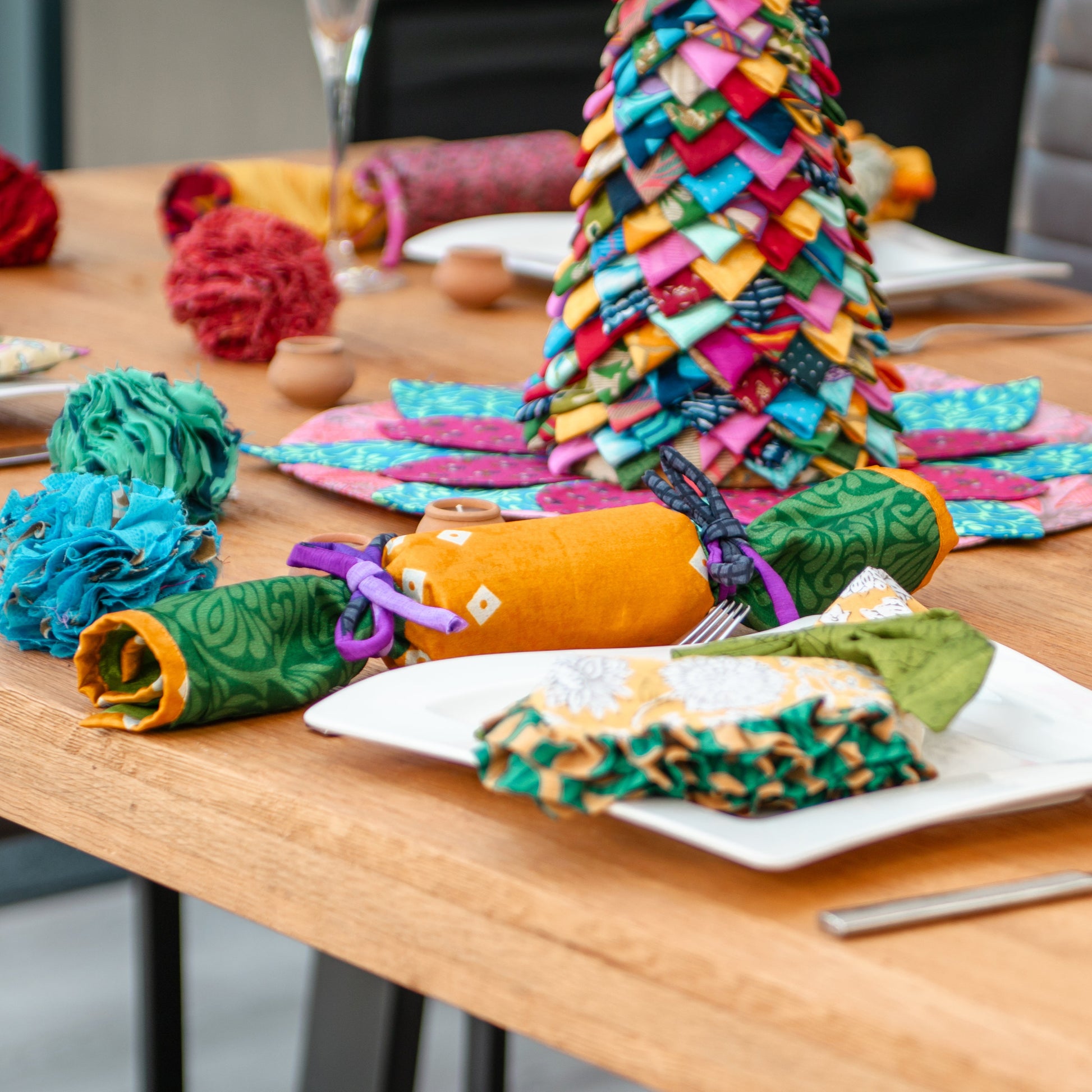 Colorful sari decorations on a wooden table