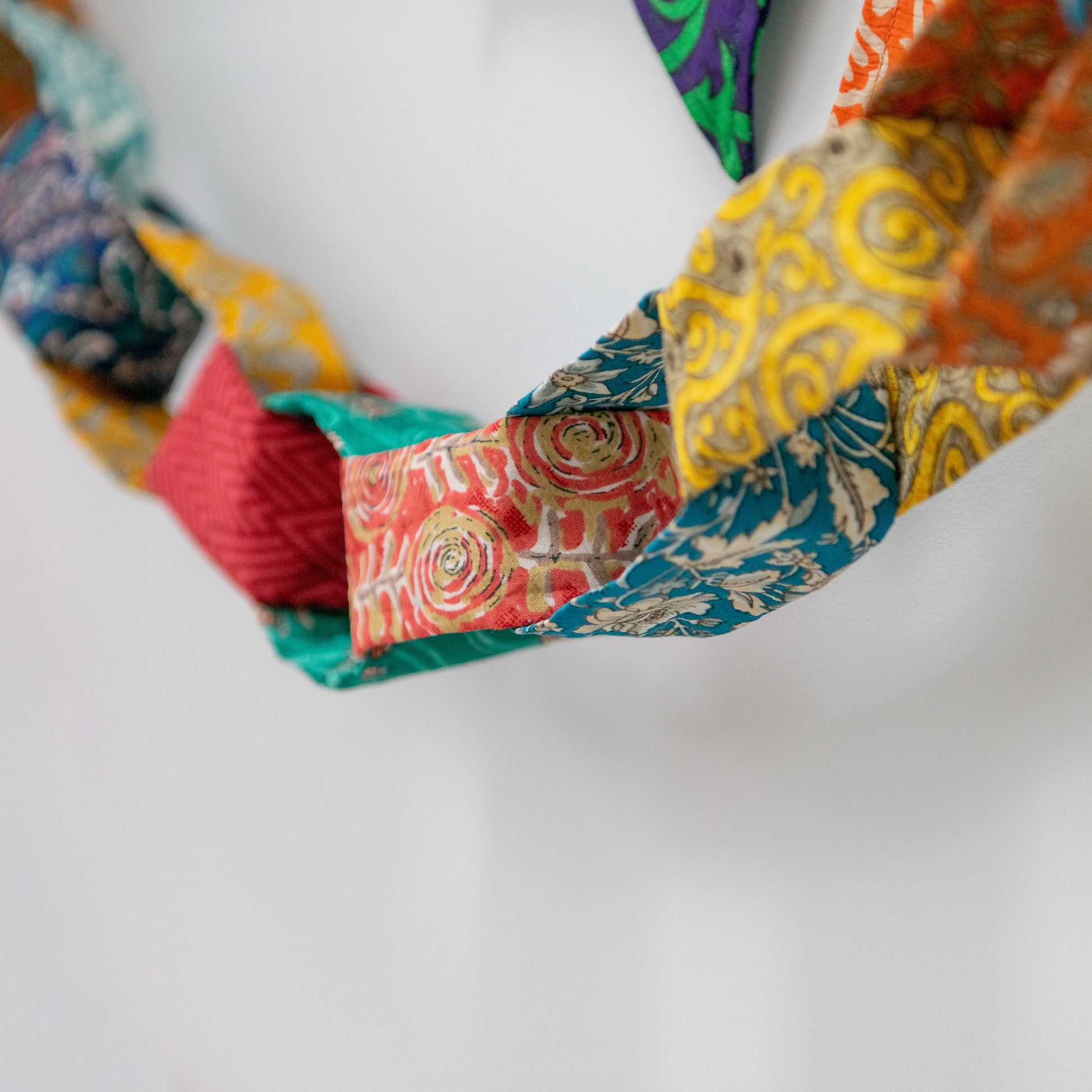 Colorful fabric chain on a white background