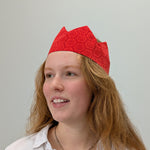Person wearing a red headband with a white background